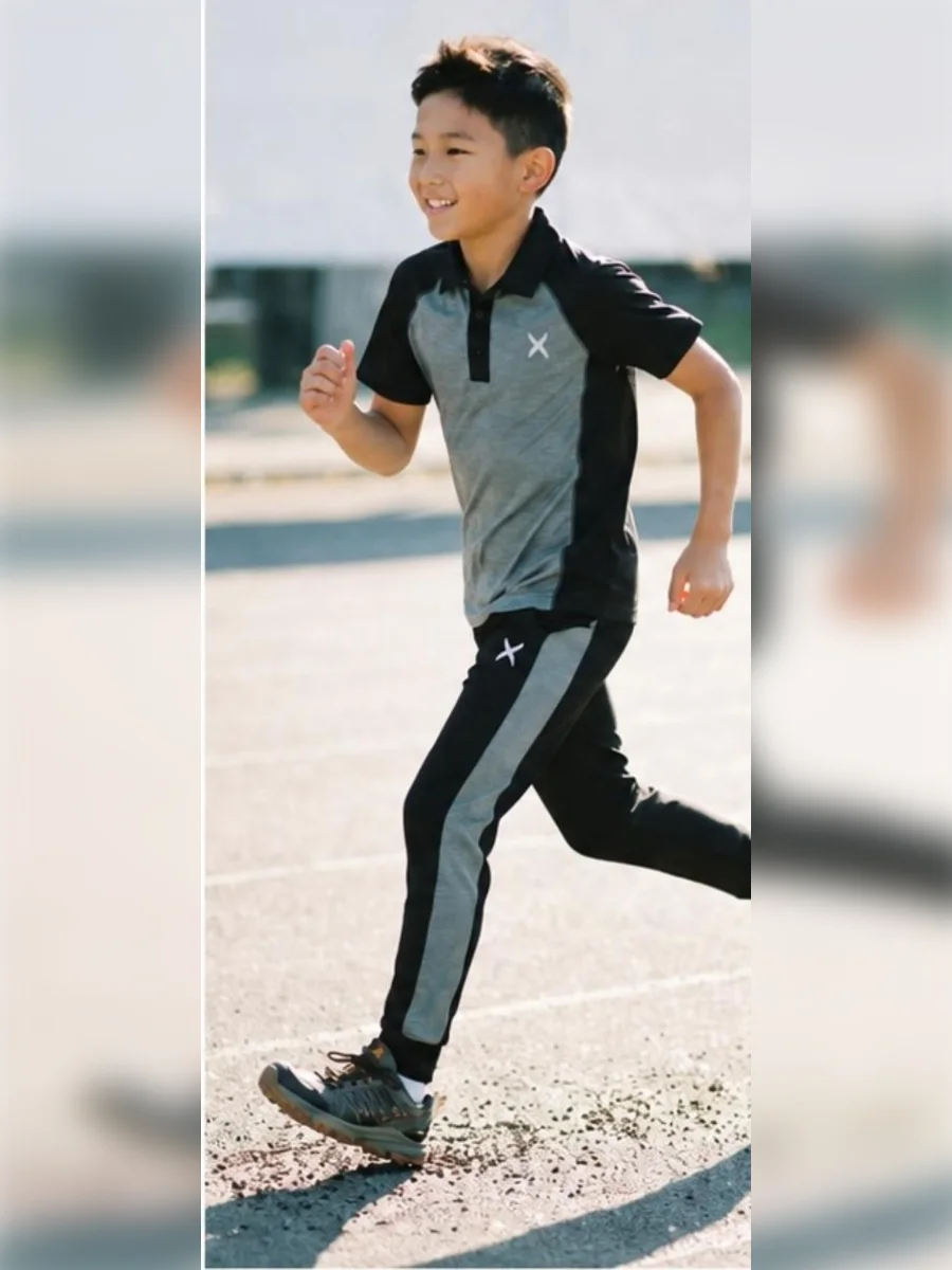 Boy running in Game Time side-panel jogger